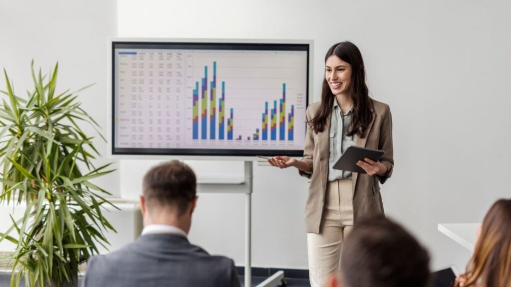 Business professional presenting market research data and analytics insights to team supporting informed decision-making and growth