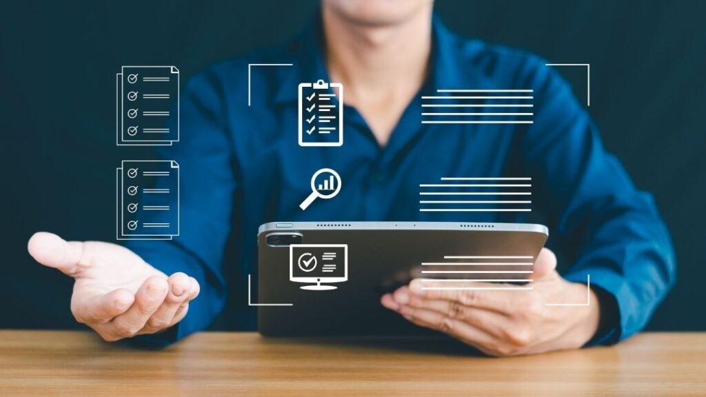 Person holding tablet with holographic icons of checklists, surveys, and data analysis, representing research tools.